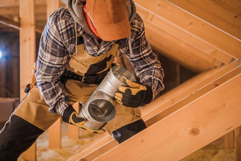 A homeowner checking insulation and weatherstripping around a window inside a typical family home.